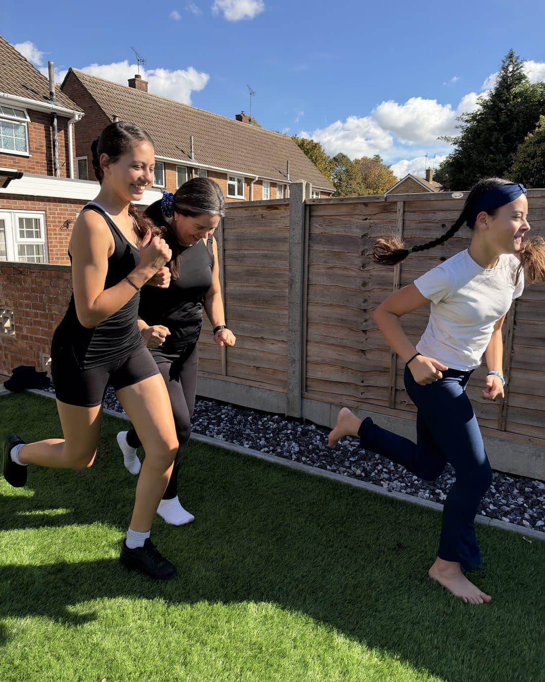 Children racing across the garden during a game