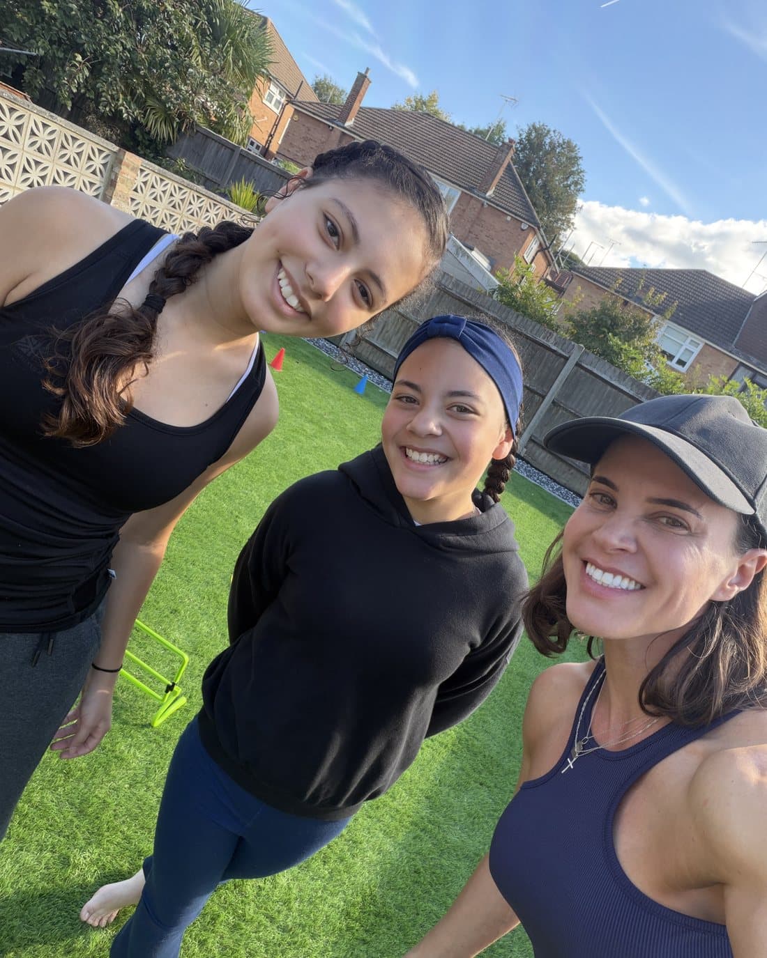 Vanessa and two children smiling at the camera